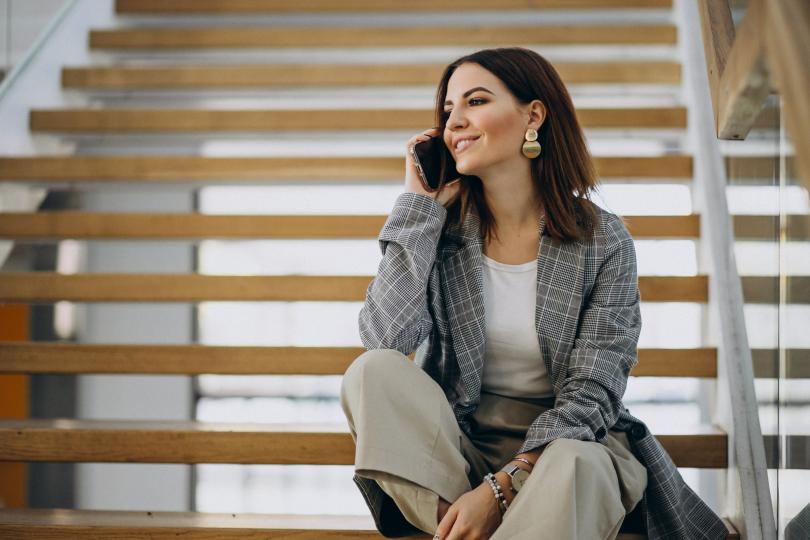 A Woman calling and smiling